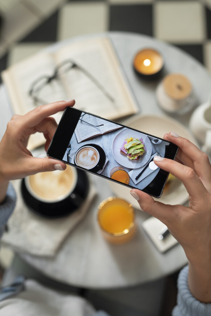 close-up-hands-taking-food-photo-with-phone close up hands taking food photo with phone
