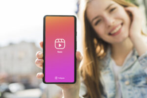 front view smiley woman holding smartphone