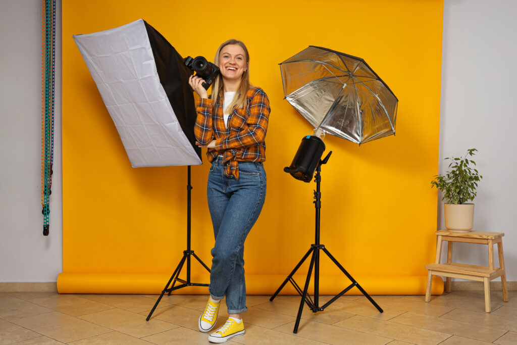 girl-photographer-photo-studio-with-studio-equipment-nearby girl photographer photo studio with studio equipment nearby