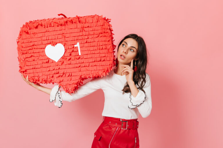long haired brunette thoughtfully looks huge red like from instagram close up shot cute tanned girl