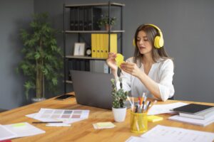 young woman working with her headphones
